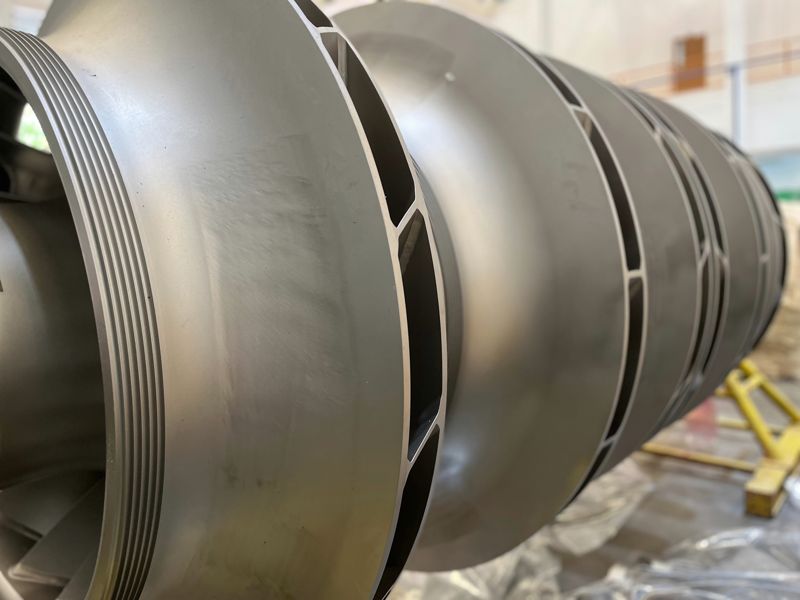 Machined rotating sections staged on the shop floor, wrapped and ready
